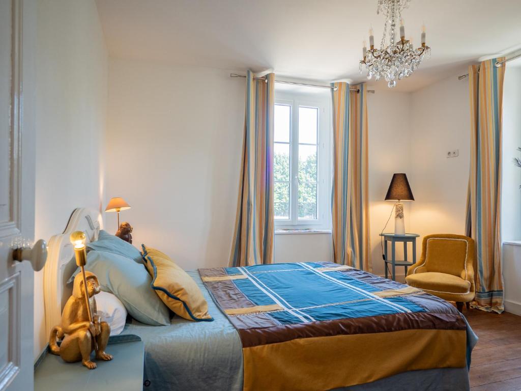 Postel nebo postele na pokoji v ubytování Manoir du Val Fouzon - Beauval