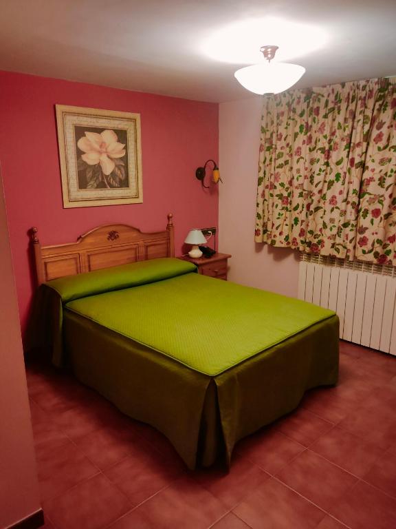 Postel nebo postele na pokoji v ubytování Hostal Las Grullas