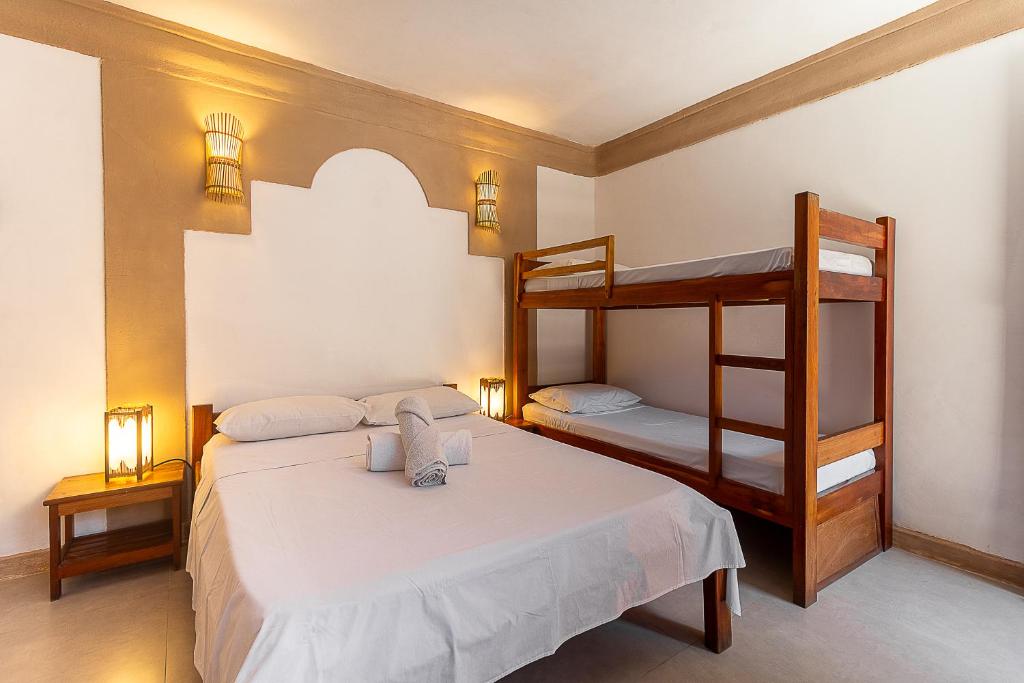 Postel nebo postele na pokoji v ubytování Na Casa 11 - Pousada e Hostel