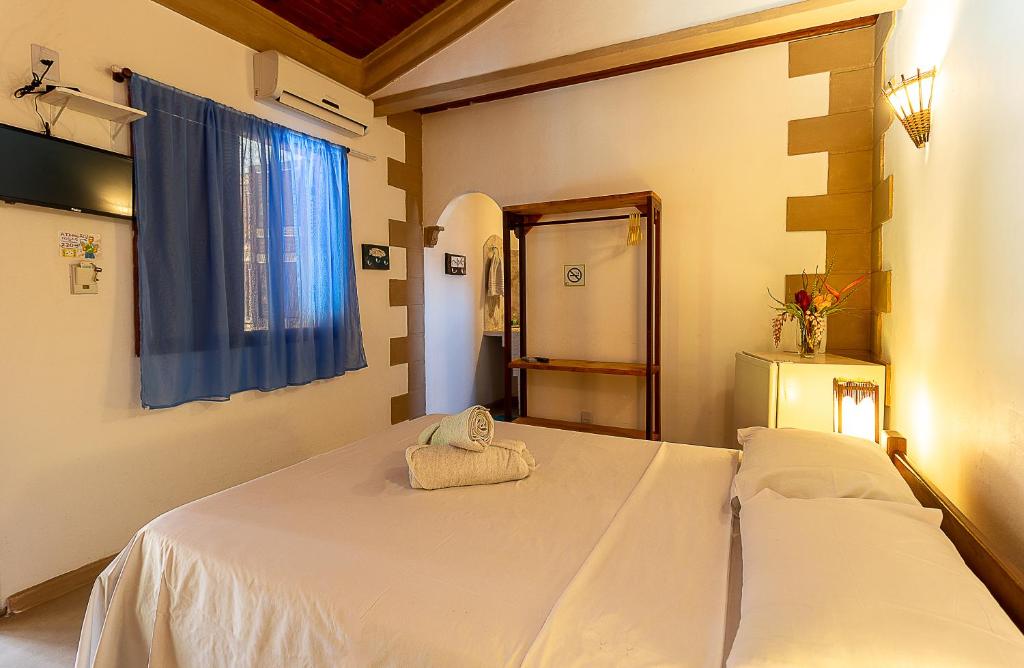 Postel nebo postele na pokoji v ubytování Na Casa 11 - Pousada e Hostel