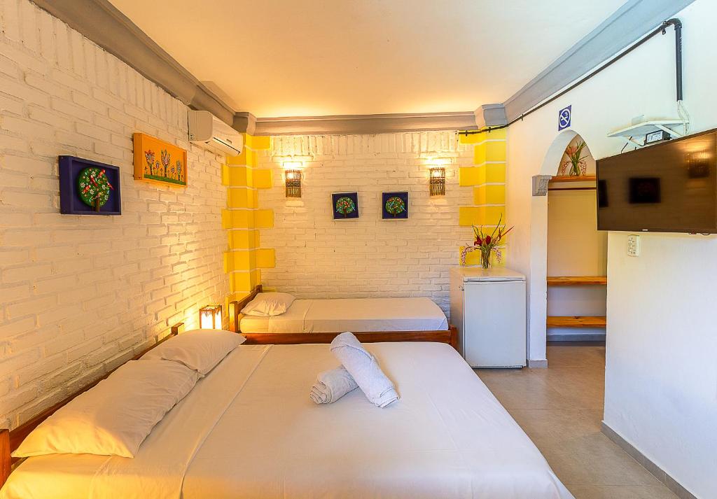 Postel nebo postele na pokoji v ubytování Na Casa 11 - Pousada e Hostel