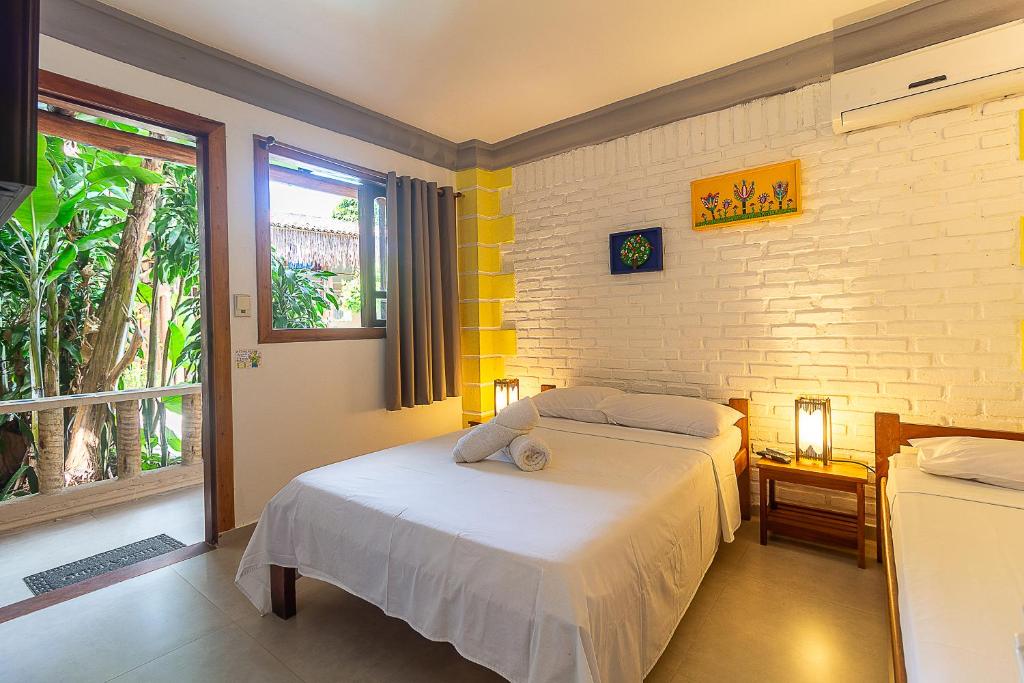 Postel nebo postele na pokoji v ubytování Na Casa 11 - Pousada e Hostel