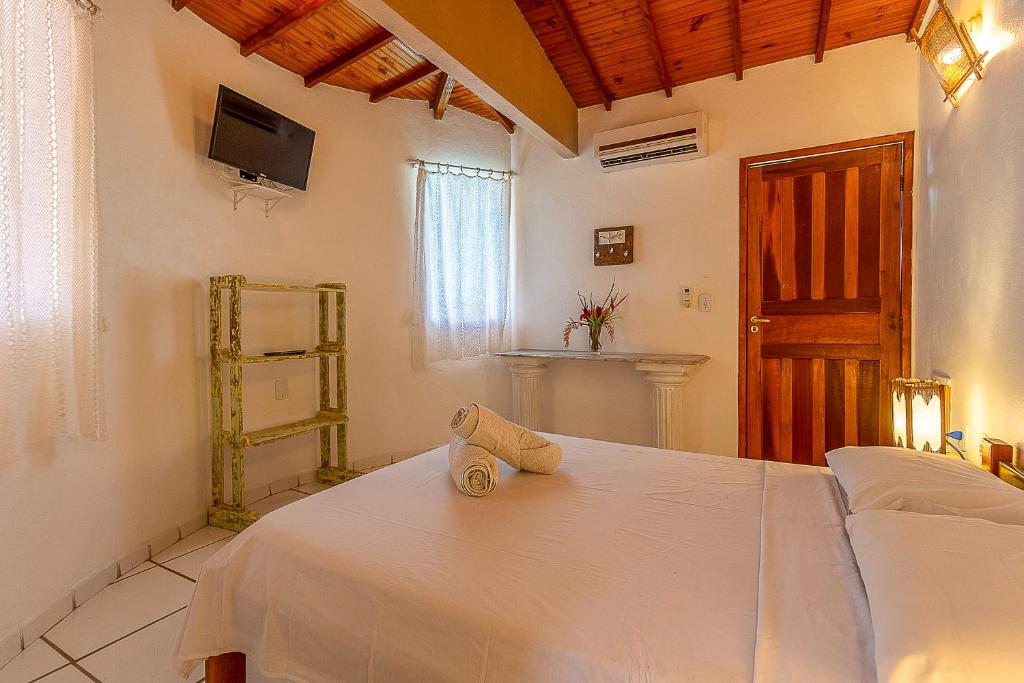 Postel nebo postele na pokoji v ubytování Na Casa 11 - Pousada e Hostel