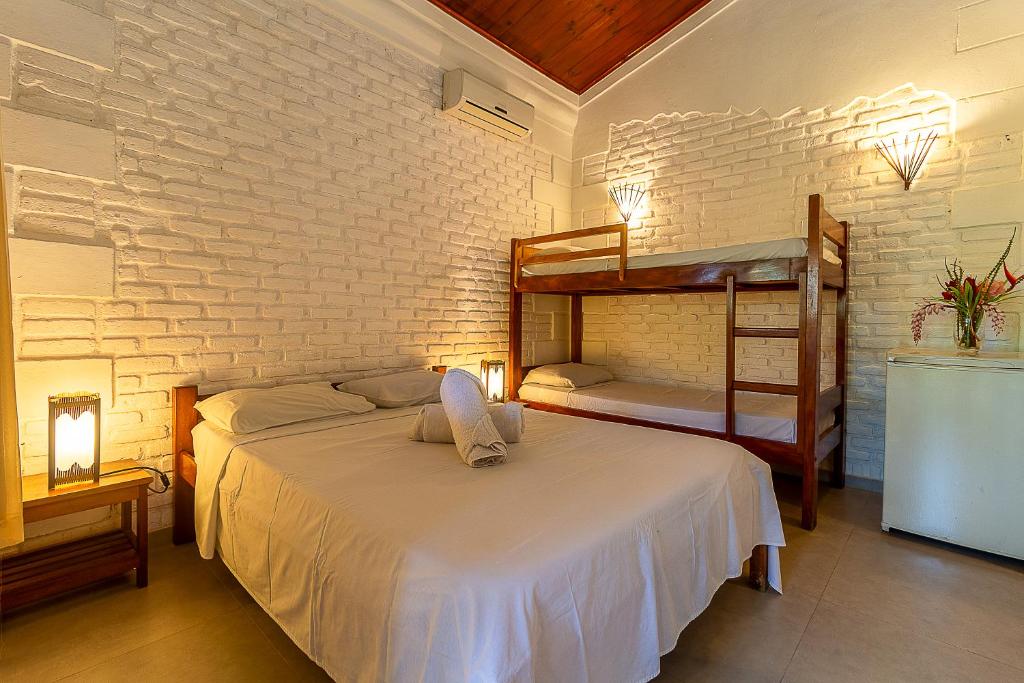 Postel nebo postele na pokoji v ubytování Na Casa 11 - Pousada e Hostel