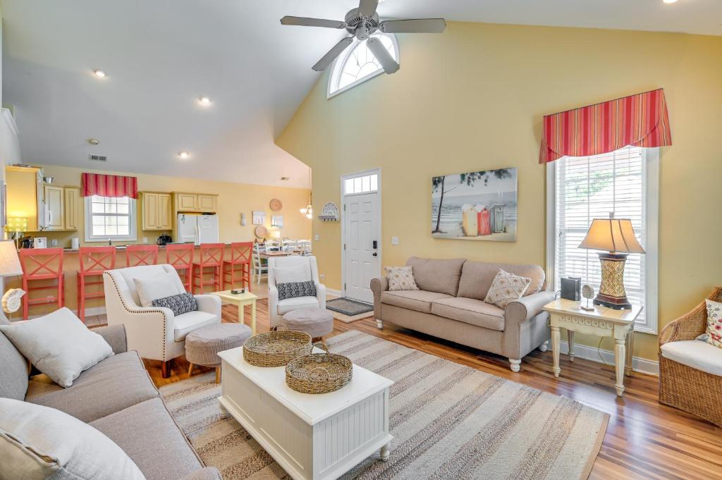 a living room with couches and a kitchen at Bermuda Bay Home - Gated Oceanfront Community in Myrtle Beach