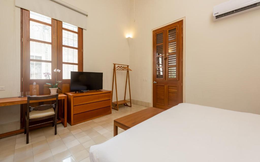 TV a/nebo společenská místnost v ubytování Villa Orquídea Boutique Hotel
