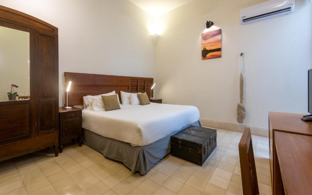 Postel nebo postele na pokoji v ubytování Villa Orquídea Boutique Hotel