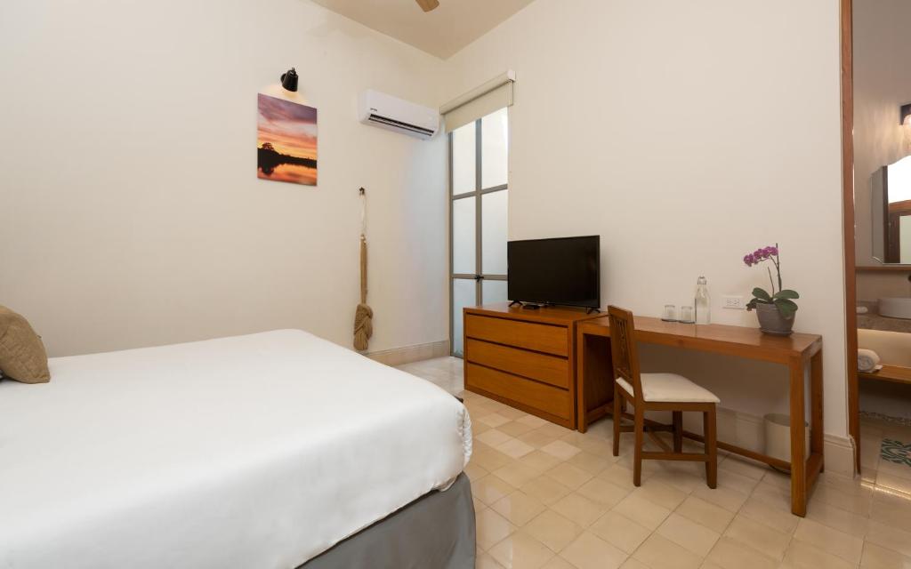TV a/nebo společenská místnost v ubytování Villa Orquídea Boutique Hotel