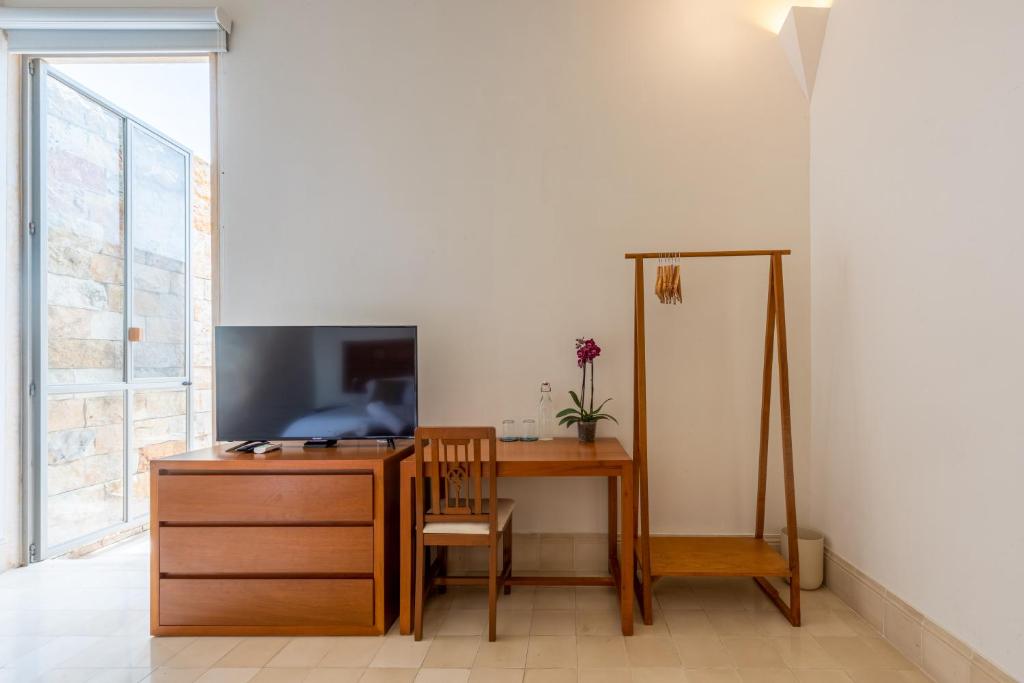 TV a/nebo společenská místnost v ubytování Villa Orquídea Boutique Hotel