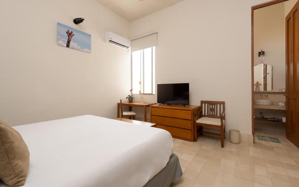 TV a/nebo společenská místnost v ubytování Villa Orquídea Boutique Hotel