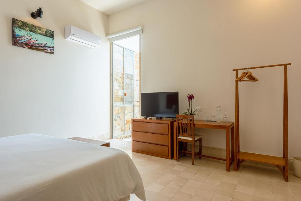TV a/nebo společenská místnost v ubytování Villa Orquídea Boutique Hotel