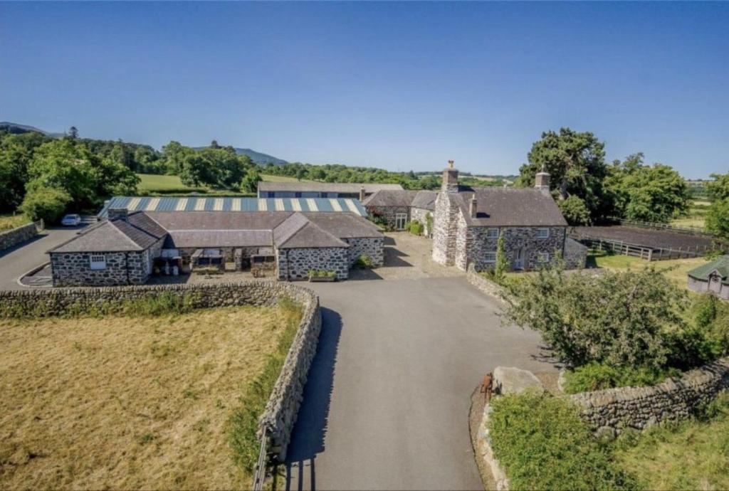 an aerial view of a house with a driveway at Tal Y Bont Uchaf in Bangor