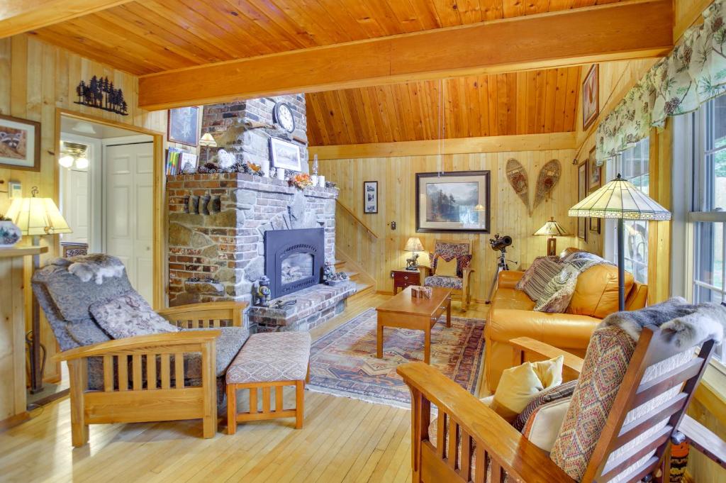 a living room with a couch and a fireplace at Hike, Ski and Explore! Owls Nest Gold Bar Cabin in Gold Bar