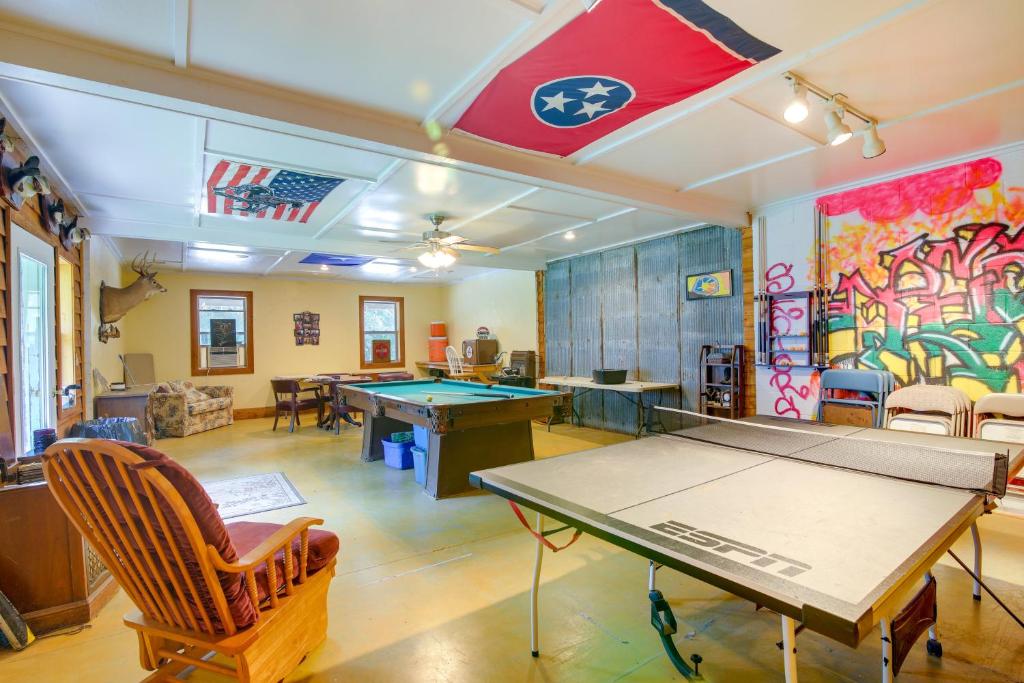 a ping pong room with a ping pong table at Tennessee Farm Vacation Rental with Game Room! 