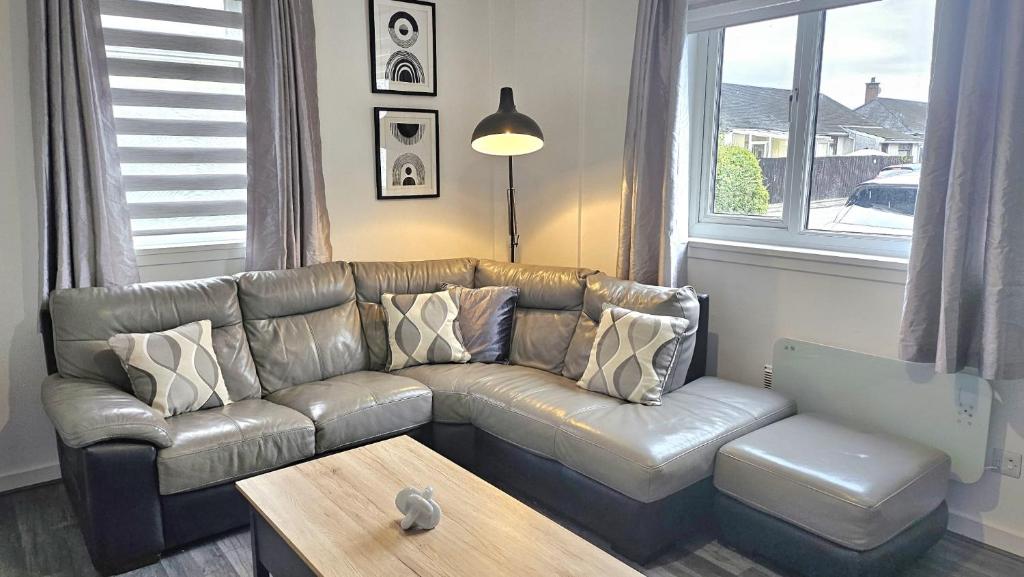 A seating area at Contemporary Highland Cottage