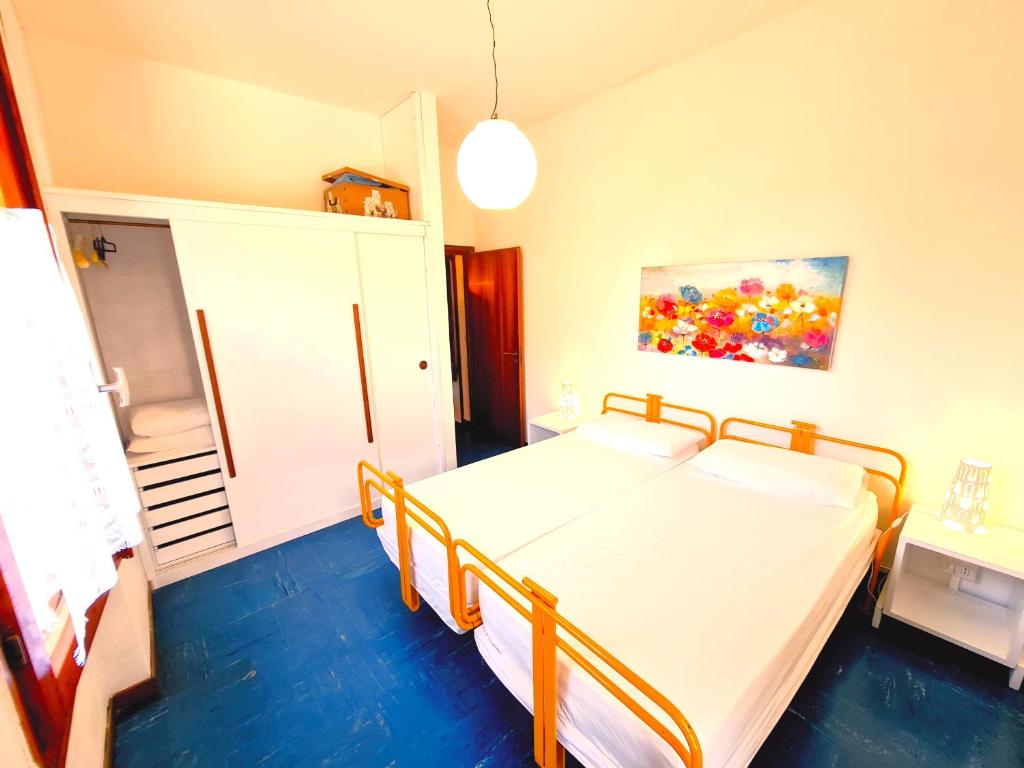 Postel nebo postele na pokoji v ubytování Residence Casa Pineta