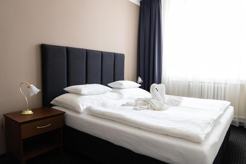 Posteľ alebo postele v izbe v ubytovaní Hotel Polana