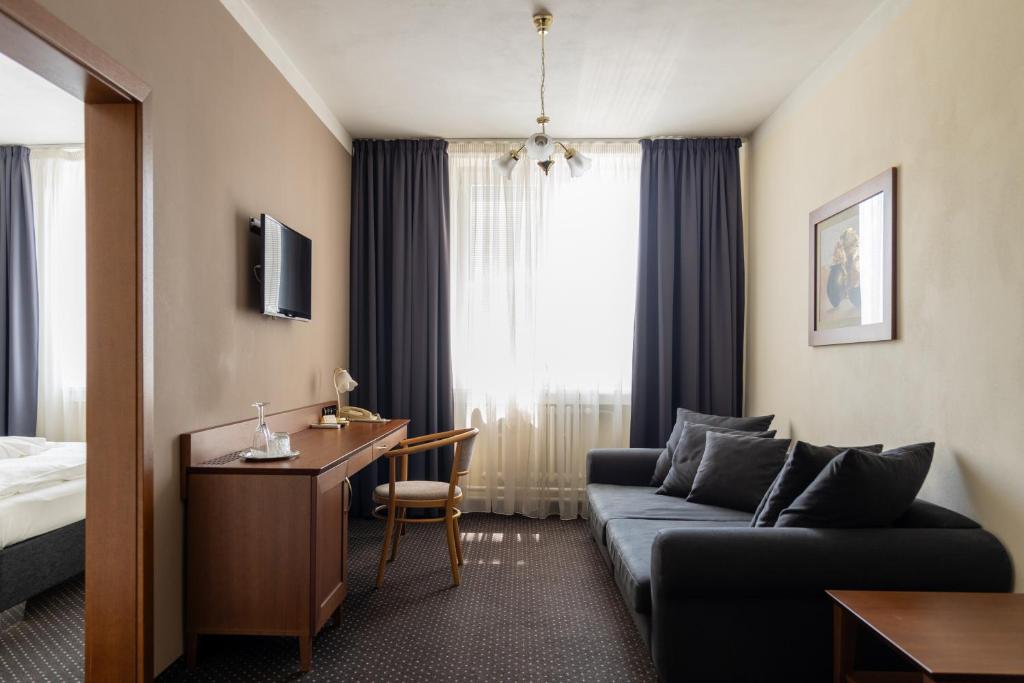 Televízia a/alebo spoločenská miestnosť v ubytovaní Hotel Polana