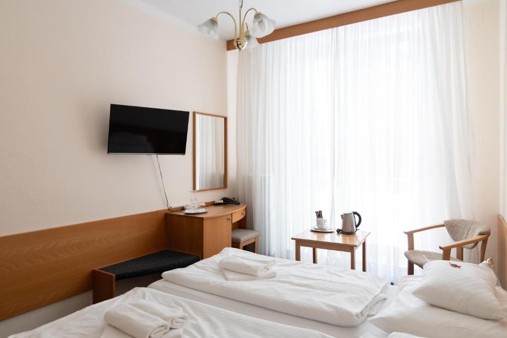 Posteľ alebo postele v izbe v ubytovaní Hotel Polana