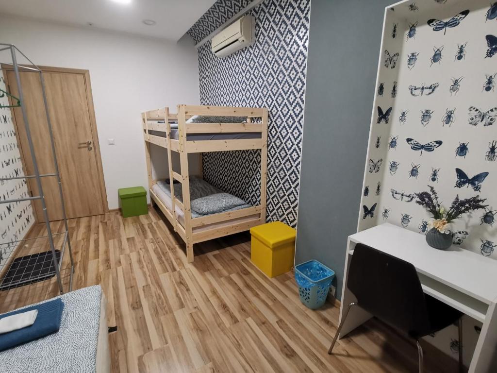 Postel nebo postele na pokoji v ubytování Tiki Taka Hostel & Pub