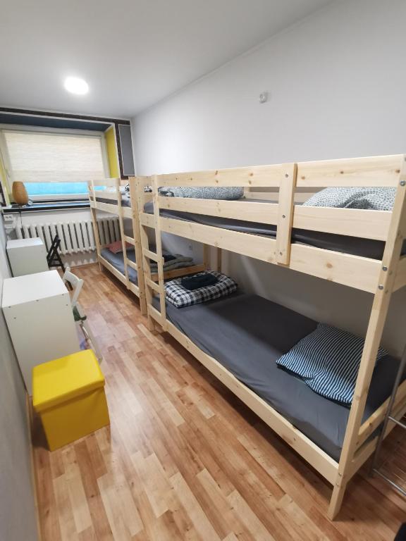 Postel nebo postele na pokoji v ubytování Tiki Taka Hostel & Pub