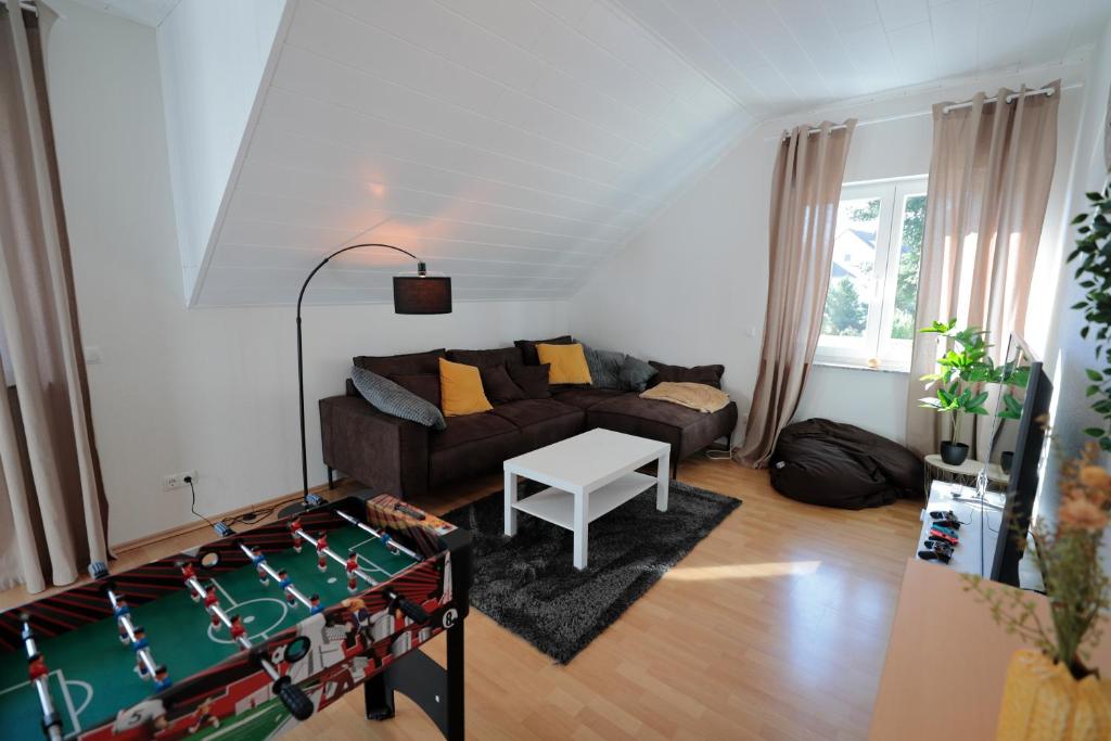Posezení v ubytování Goldhouse - Sauna, Whirlpool, Switch, Darts & mehr