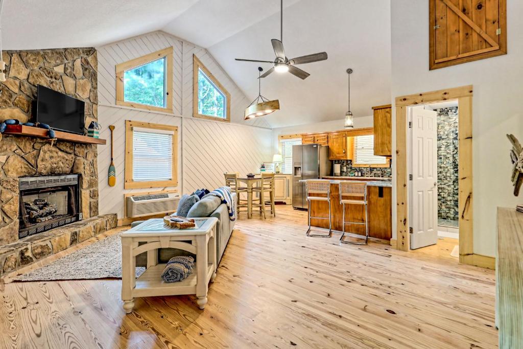 a living room with a couch and a fireplace at The Falls in Hood