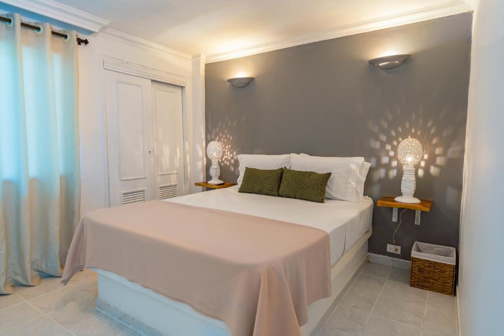 Postel nebo postele na pokoji v ubytování Hotel Cocoliso Island Resort