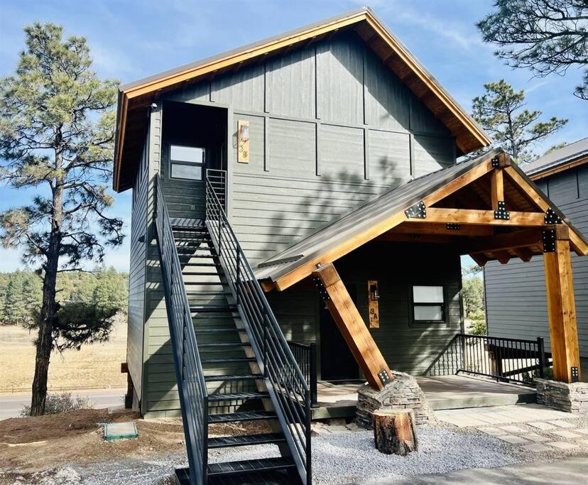 a house with a staircase in front of it at Luxury Mountain Escape! in Show Low