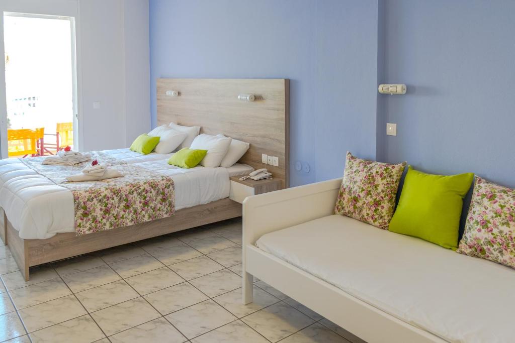 Postel nebo postele na pokoji v ubytování Evelin Hotel