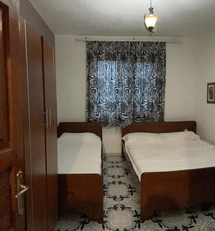 Postel nebo postele na pokoji v ubytování Arta Guesthouse