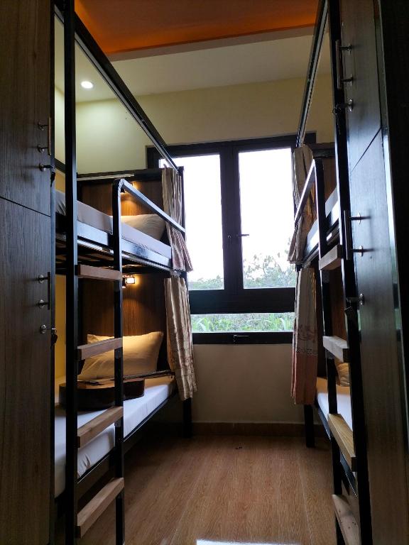 Postel nebo postele na pokoji v ubytování Ngoc Tran Hotel