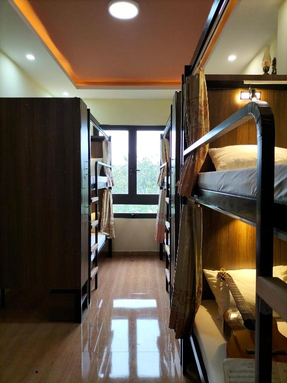 Postel nebo postele na pokoji v ubytování Ngoc Tran Hotel