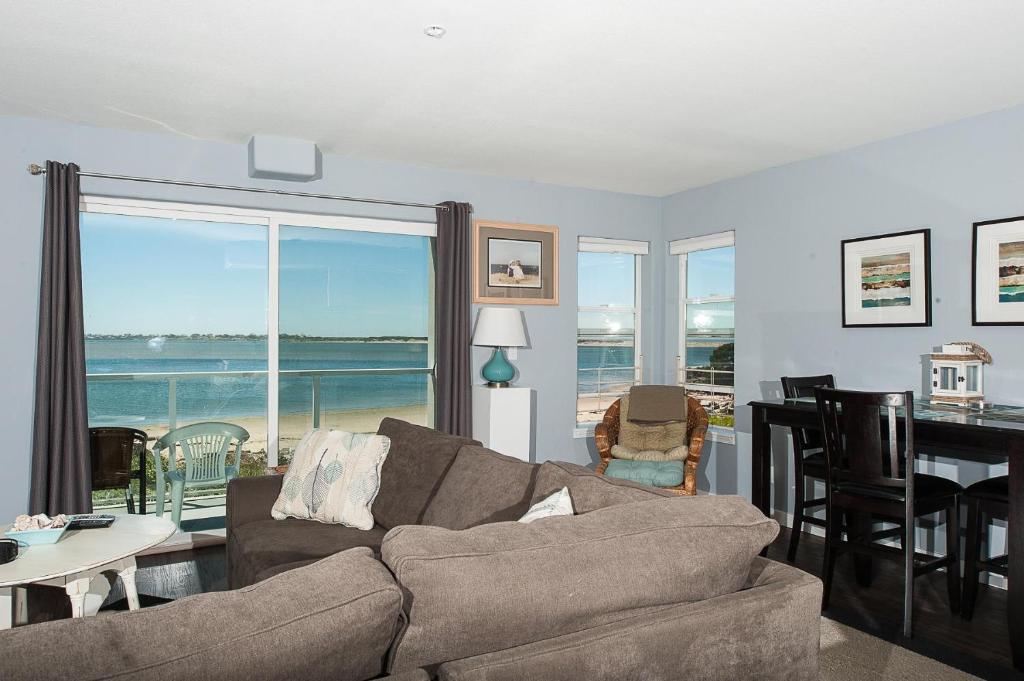 a living room with a couch and a table at Waters Edge 214 in Lincoln City