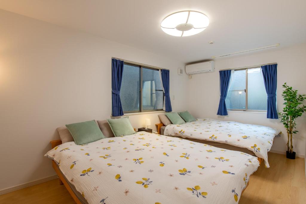 Postel nebo postele na pokoji v ubytování 新宿6丁目戸建