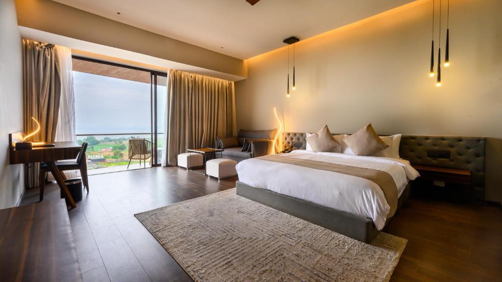 Postel nebo postele na pokoji v ubytování Aria Resort & Spa