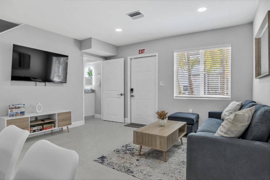 a living room with a couch and a table at Sistrunk Shades Villas #3 - Brand New Townhomes Downtown Fort Lauderdale in Fort Lauderdale