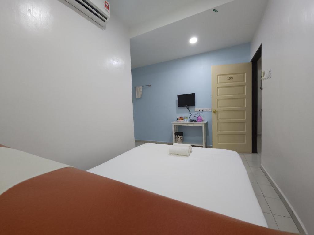 Postel nebo postele na pokoji v ubytování Minshu RoomStay