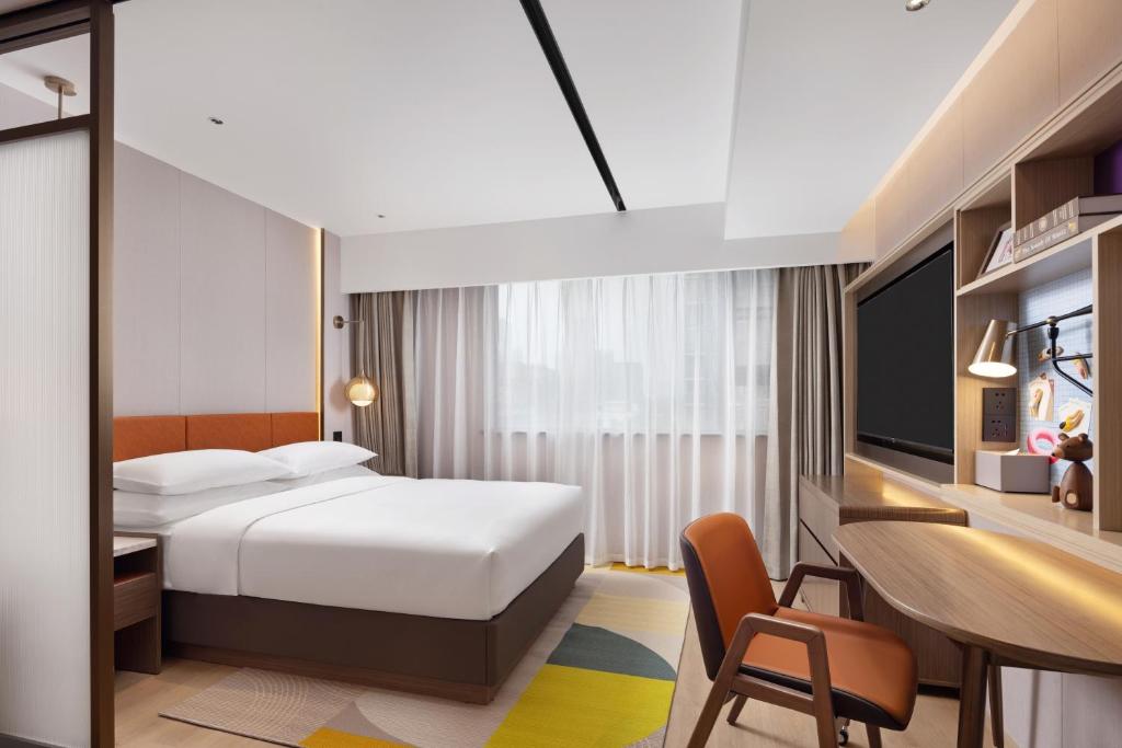 Postel nebo postele na pokoji v ubytování Home2 Suites by Hilton Chengdu Kuanzhai Alley