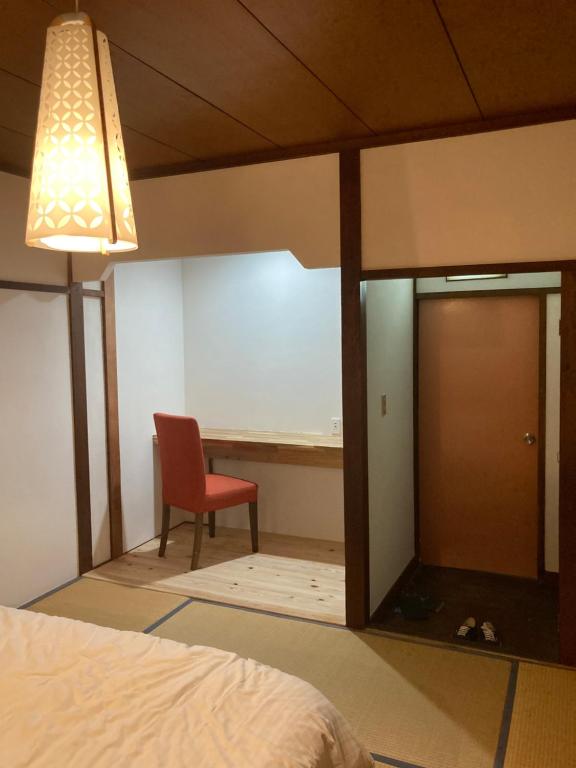 Postel nebo postele na pokoji v ubytování Hotel shirahama