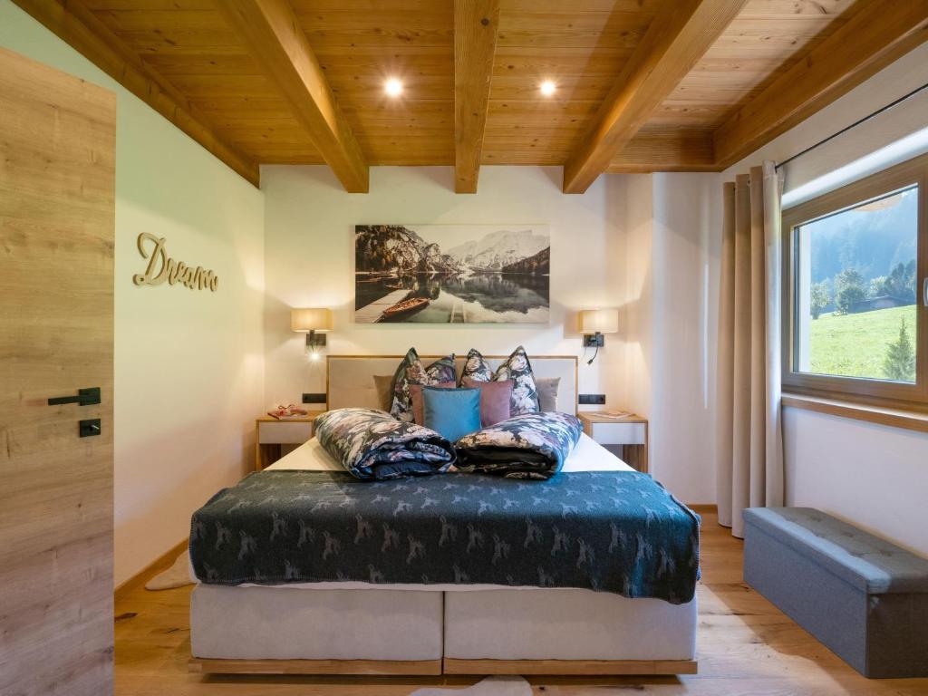 Postel nebo postele na pokoji v ubytování Das Kaiserwohl Chalet