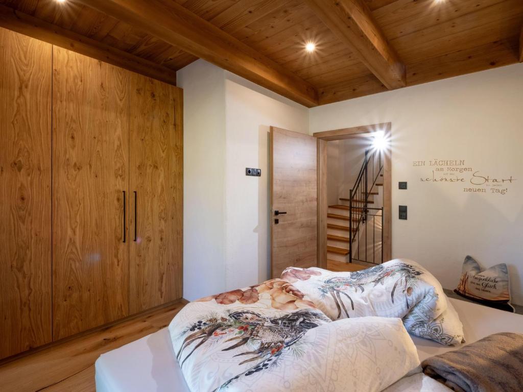 Postel nebo postele na pokoji v ubytování Das Kaiserwohl Chalet