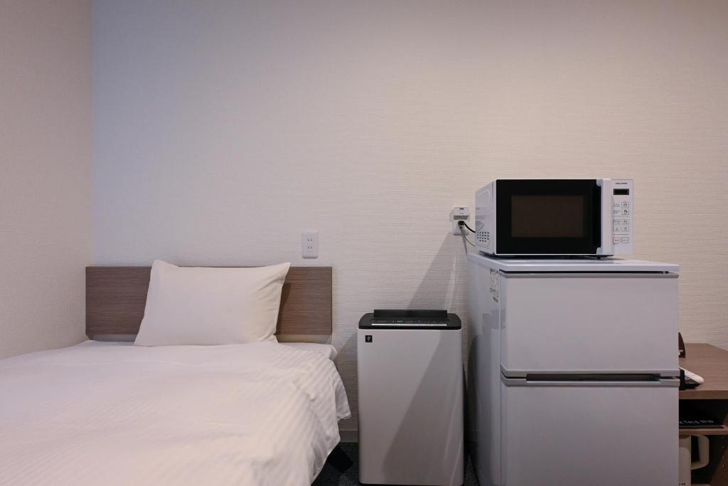 TV a/nebo společenská místnost v ubytování HOTEL R9 The Yard Ashikagaekinishi