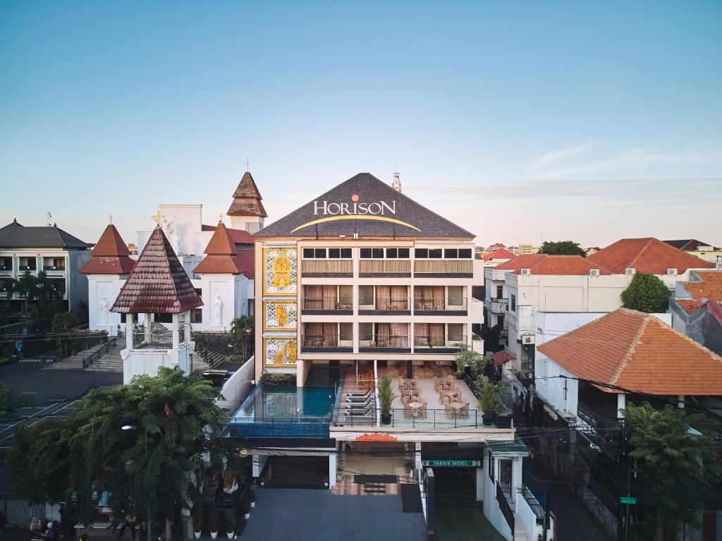 an aerial view of a hotel in a city at Horison Kuta Bali in Kuta