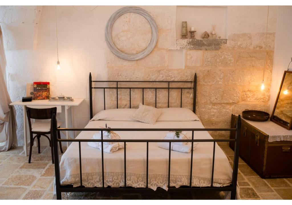 Postel nebo postele na pokoji v ubytování Masseria Verbena Agriturismo