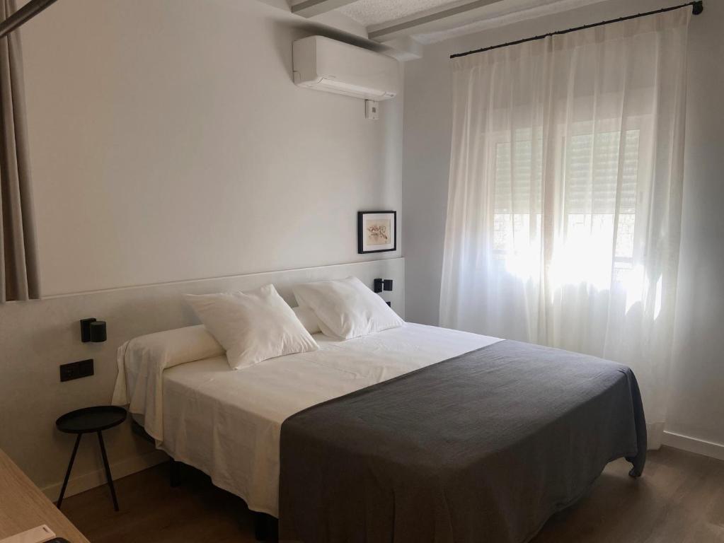 Postel nebo postele na pokoji v ubytování Calendula Hotel & Apartaments