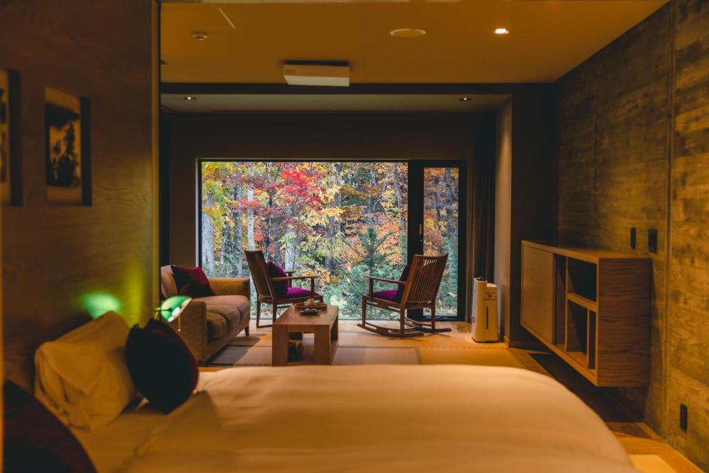 Letto o letti in una camera di Okujozankei Onsen Kasho Gyoen