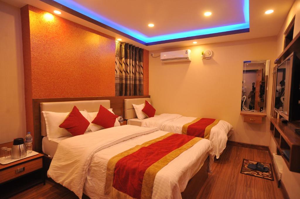 Postel nebo postele na pokoji v ubytování Hotel Arati Pvt. Ltd.