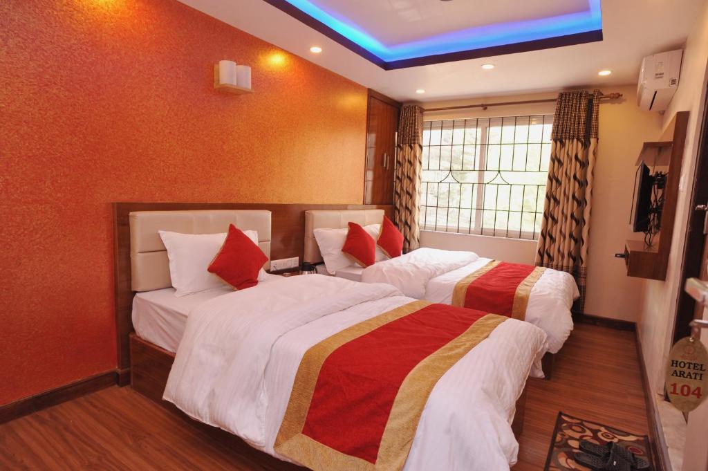 Postel nebo postele na pokoji v ubytování Hotel Arati Pvt. Ltd.