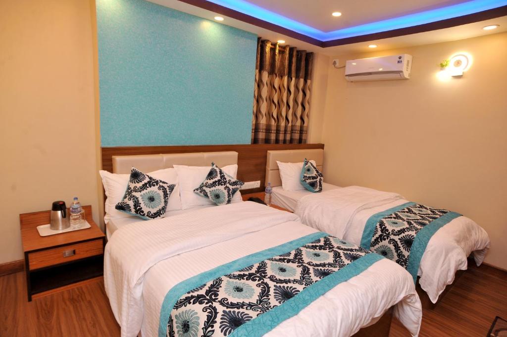 Postel nebo postele na pokoji v ubytování Hotel Arati Pvt. Ltd.